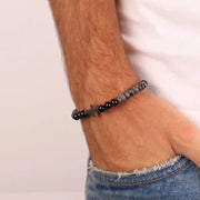 Bracciale in Acciaio con sfere nere e croce centrale in acciaio