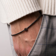 Bracciale in Acciaio con cristalli neri e piccolo timone centrale