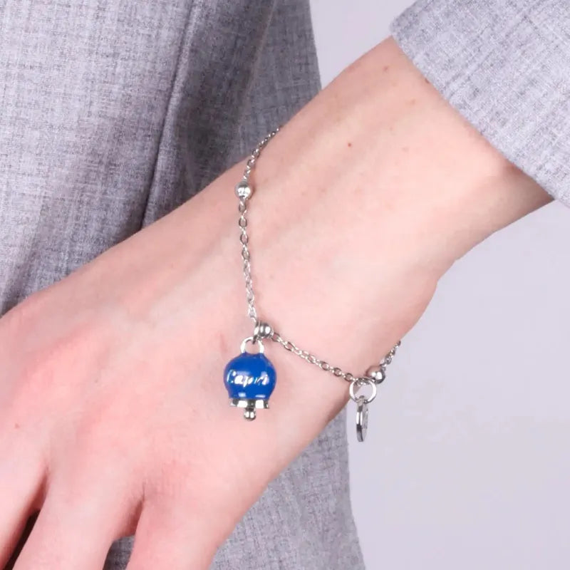 Bracciale in Acciaio con campanella pendente blu   con scritta Capri - BYSIMON gioielli