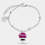 Bracciale in Acciaio con campanella pendente borgogna   con scritta Capri - BYSIMON gioielli
