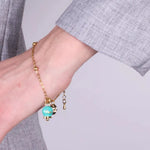 Bracciale in Acciaio con campanella  pendente  verde con scritta Capri - BYSIMON gioielli