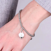 Bracciale in Acciaio con campanella  pendente bianca  con scritta Capri