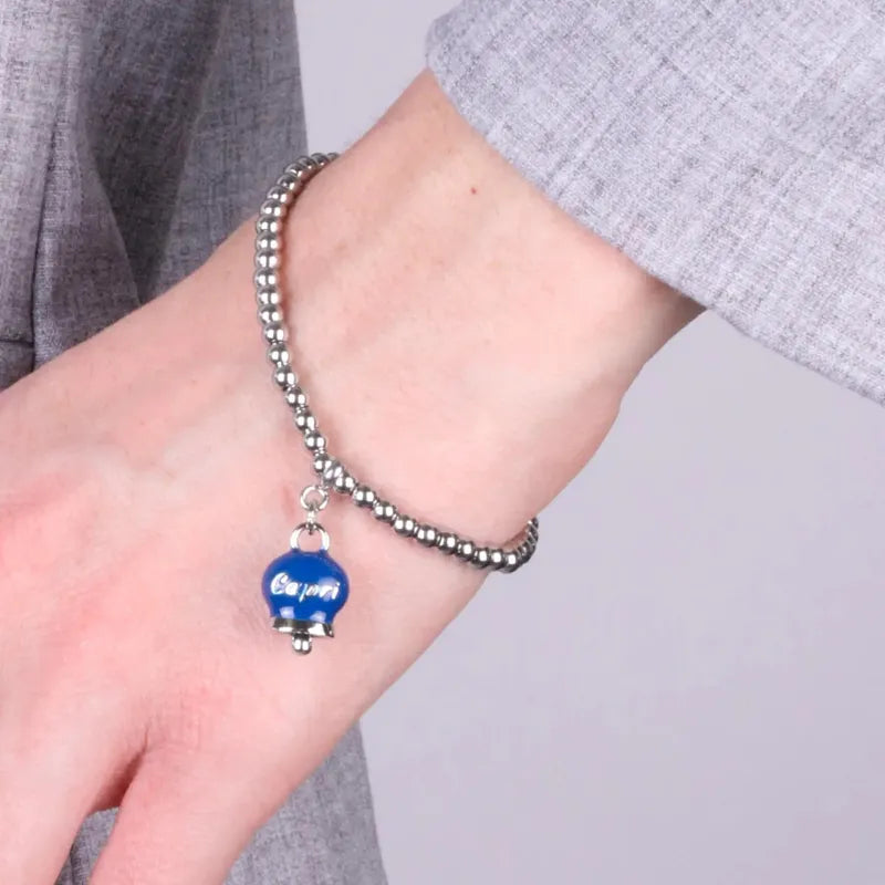 Bracciale in Acciaio con campanella pendente blu   con scritta Capri - BYSIMON gioielli