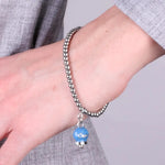 Bracciale in Acciaio  con campanella pendente blu cobalto   con scritta Capri - BYSIMON gioielli