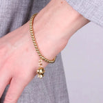 Bracciale in Acciaio con campanella pendente placcata oro   con scritta Capri - BYSIMON gioielli