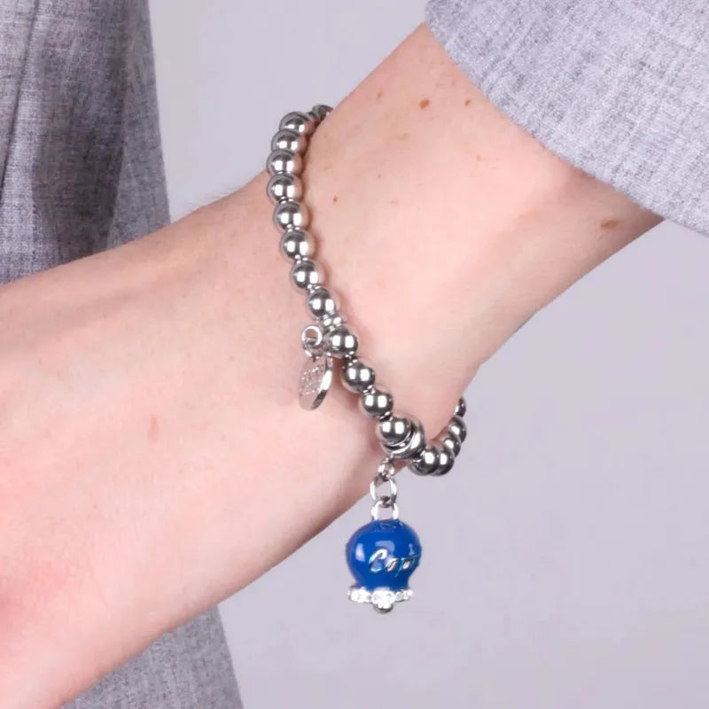 Bracciale in Acciaio  con campanella pendente azzurra   con scritta Capri - BYSIMON gioielli