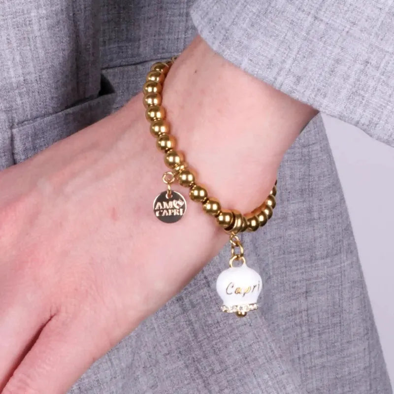 Bracciale in Acciaio  con campanella  bianca e oro  con scritta Capri - BYSIMON gioielli