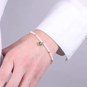 Bracciale in Acciaio con giro di perle e cuore verde