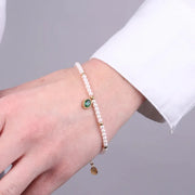 Bracciale in Acciaio con giro di perle e cristallo ovale verde