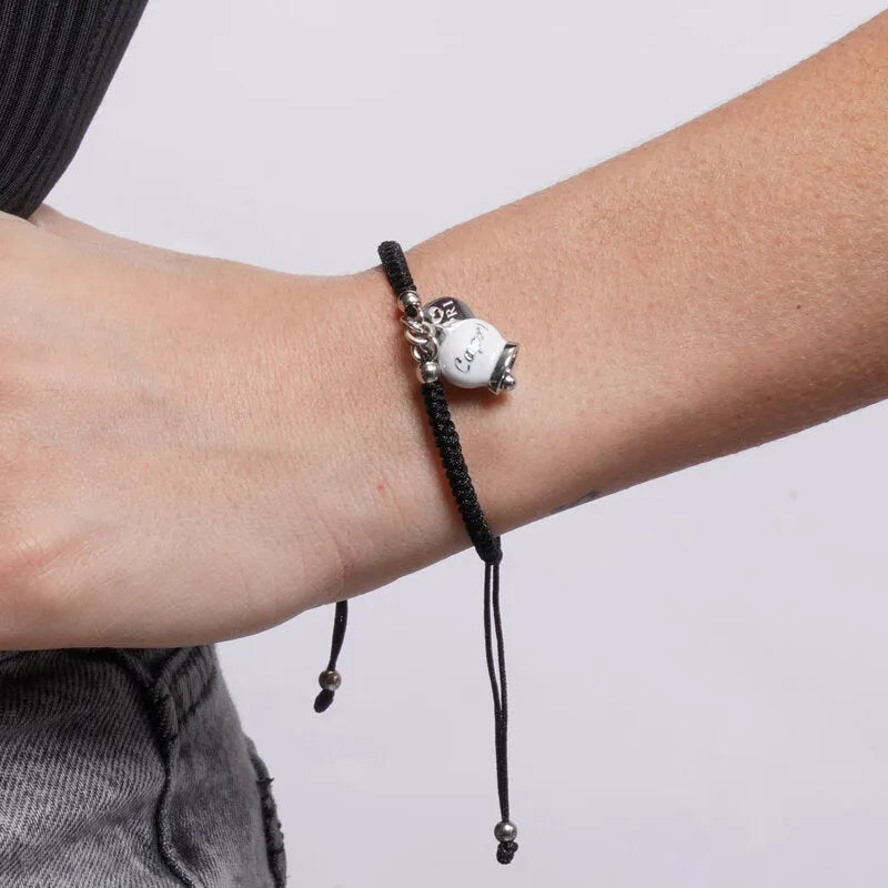 Bracciale in Acciaio Cordino nero e Campanella Portafortuna Capri - Colore Bianca - gioiello BySimon