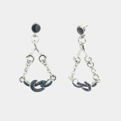 Metal earrings with dangling knots embellished with blue enamel