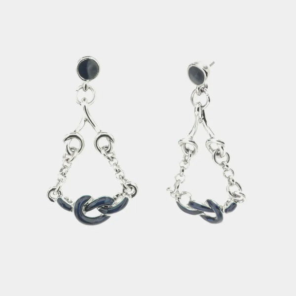 Metal earrings with dangling knots embellished with blue enamel