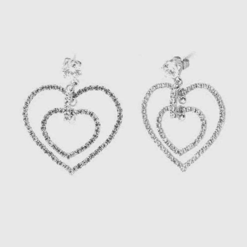 Metal dangle earrings with a double heart embellished with crystals