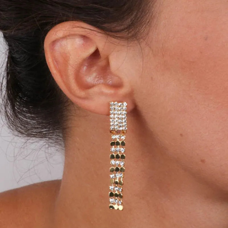 Long, multi-strand metal earrings, embellished with white crystals