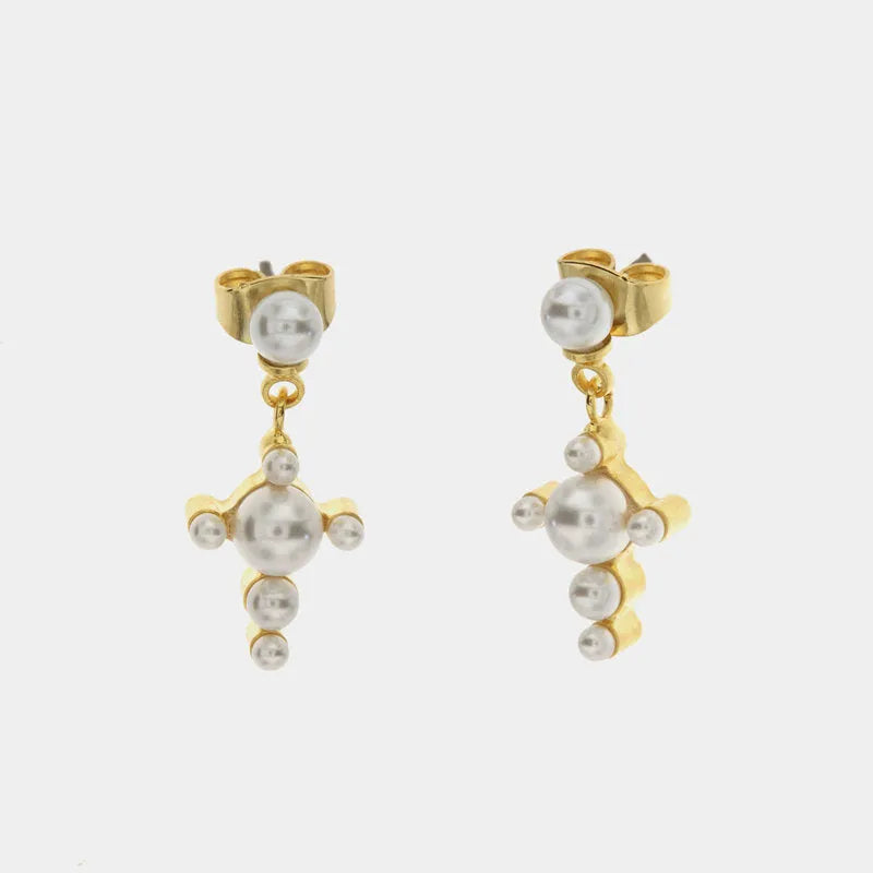 Metal pendant earrings in the shape of a cross embellished with white pearls