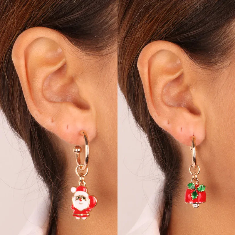 Metal earrings with Santa Claus and bell with holly