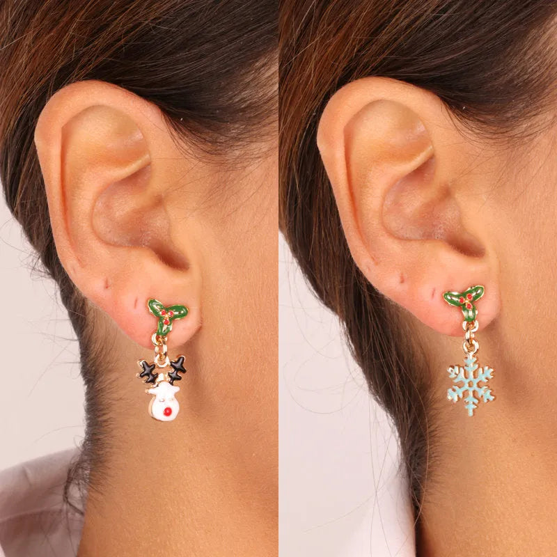 Metal earrings with snowflake and snowman