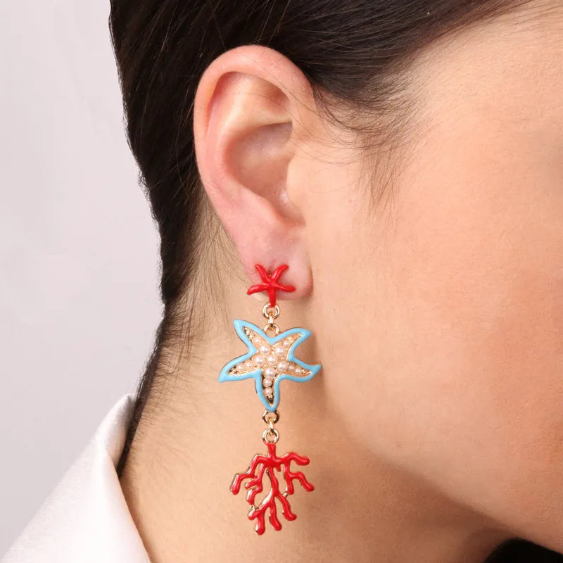 Metal earrings with starfish and corals