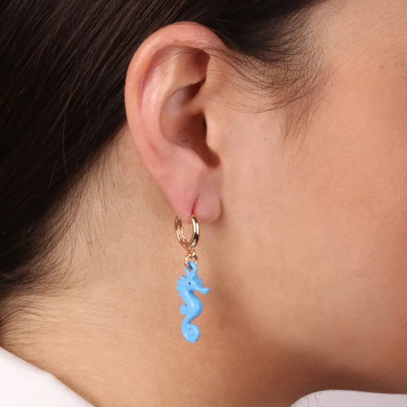 Metal earrings with seahorse pendant
