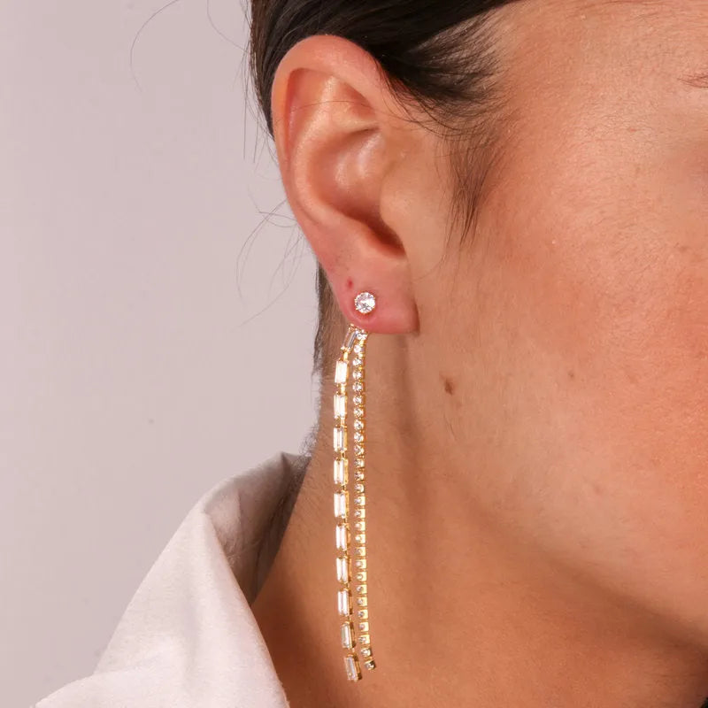 Metal earrings with hanging white crystals