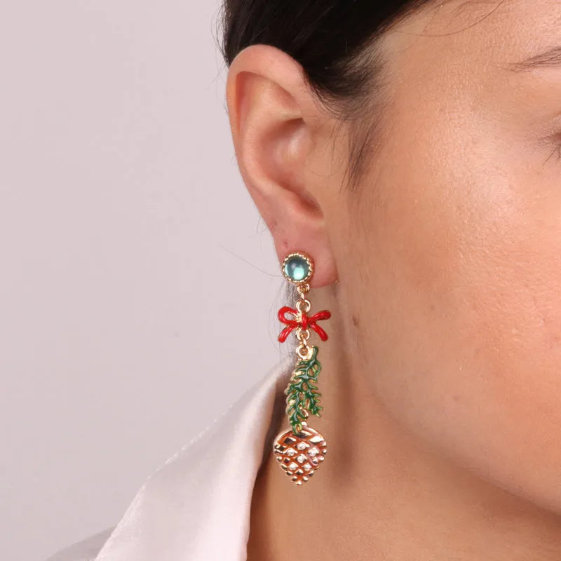 Metal earrings with pine cone and hanging bow