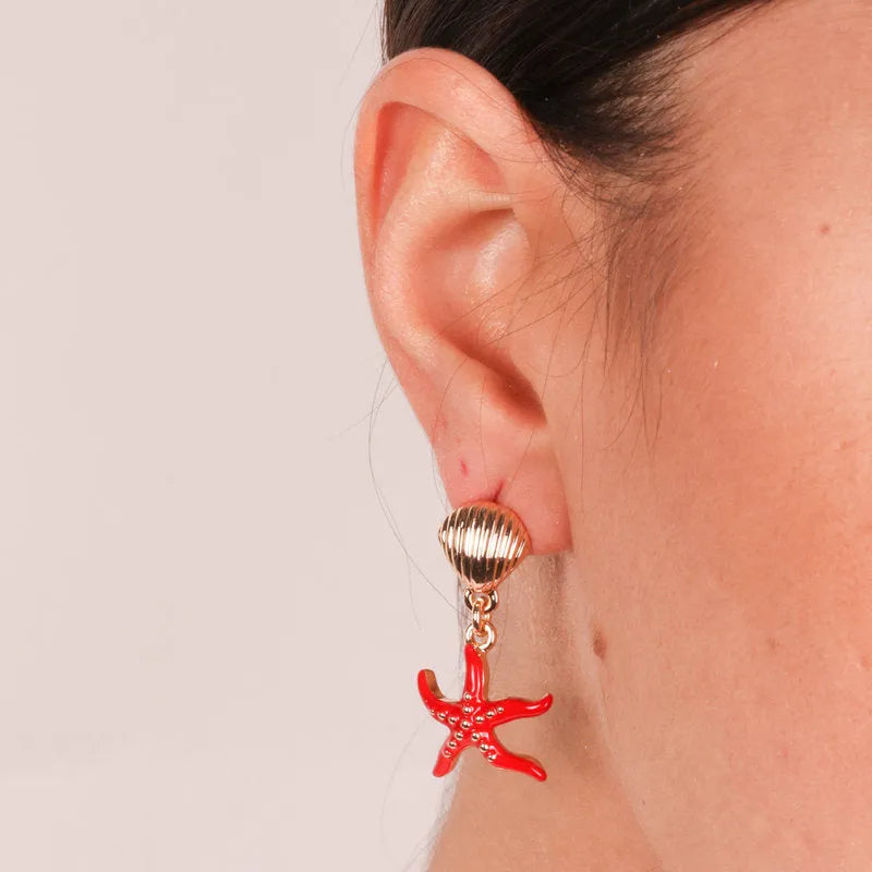 Metal earrings with red starfish