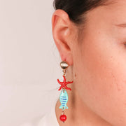Orecchini in Metallo con conchiglia al lobo e stella marina e pesciolino pendenti