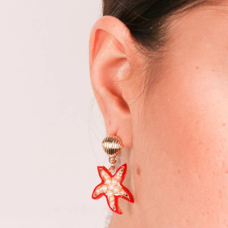 Metal earrings with red starfish