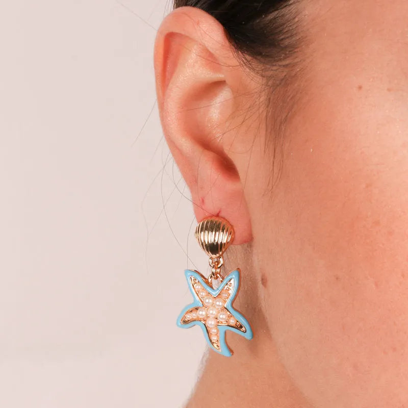 Metal earrings with blue starfish