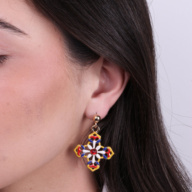 Metal earrings with hanging colored crosses