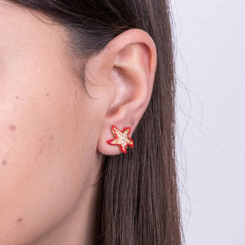Metal earrings with red starfish