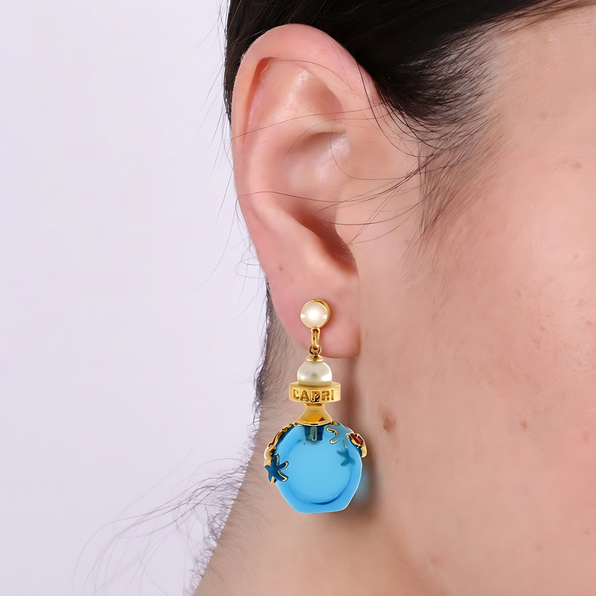 Orecchini in Metallo con bottiglina con scritta Capri