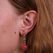 Orecchini in Metallo con dado rosso
