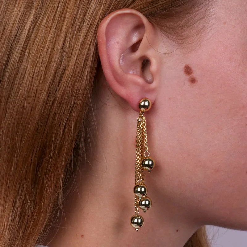 Multi-strand metal earrings with shiny pearls