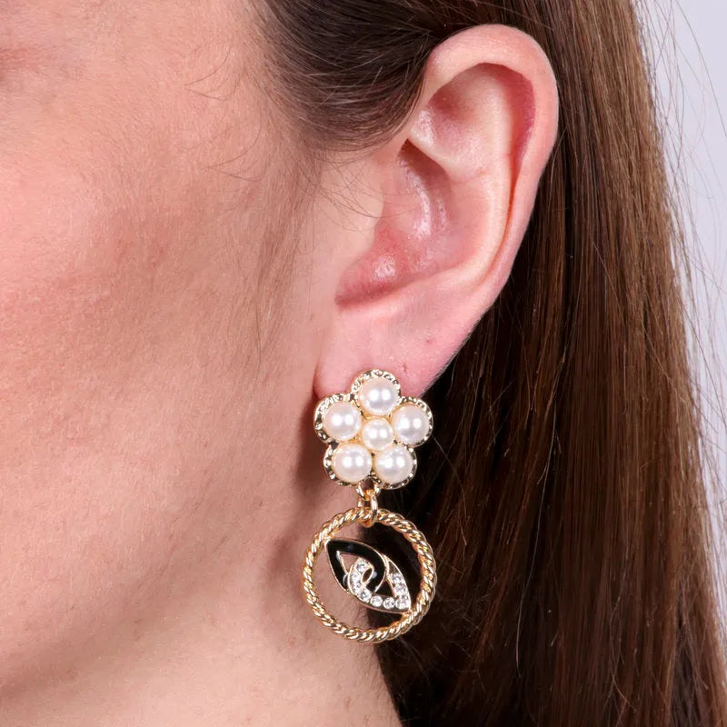 Metal earrings with pearl flower and round pendant