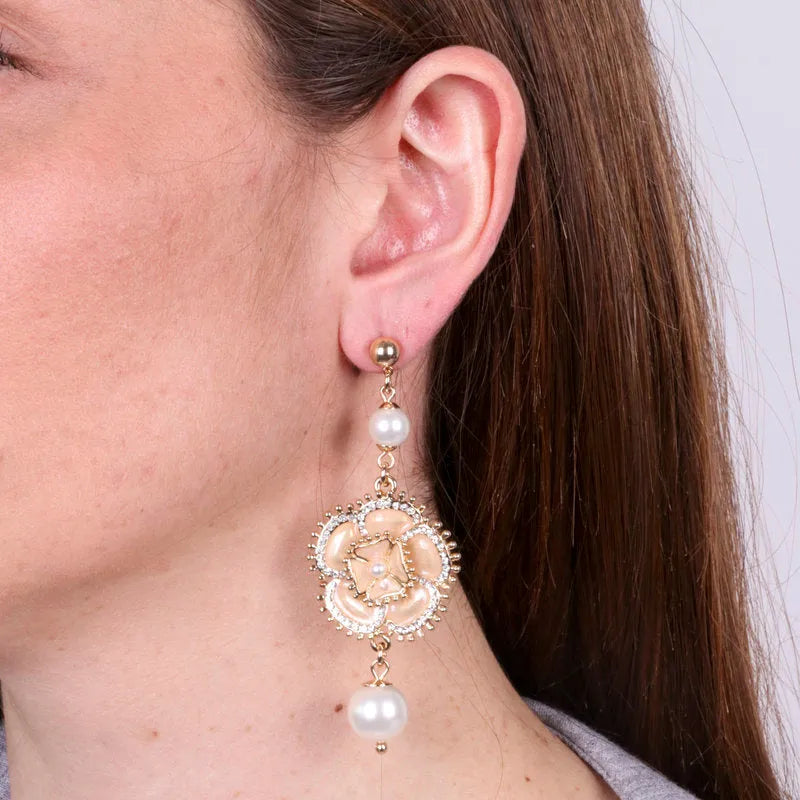 Metal earrings with hanging flower and white pearl