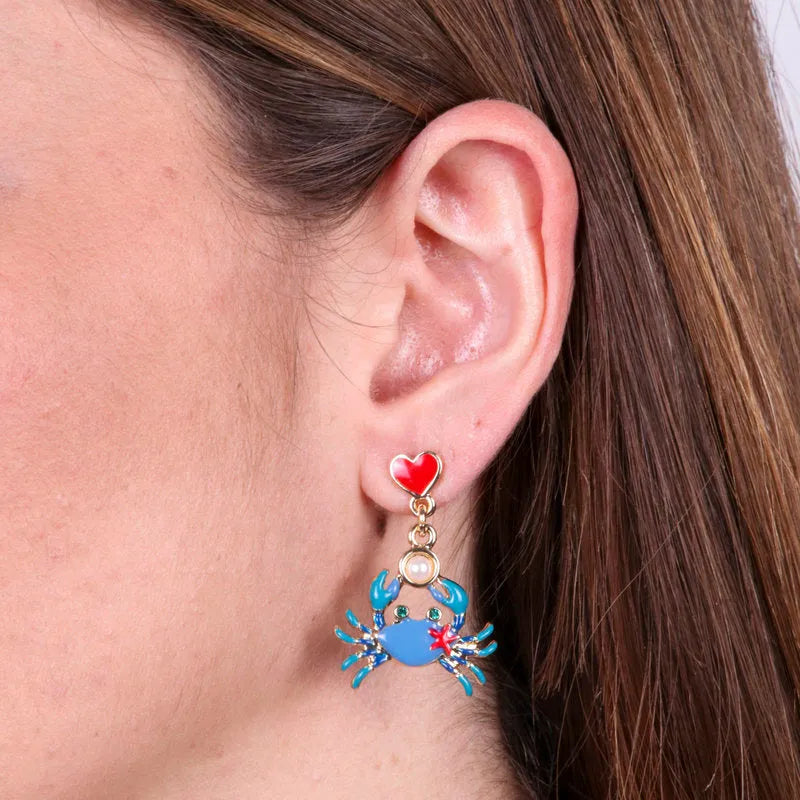 Metal earrings with blue crab