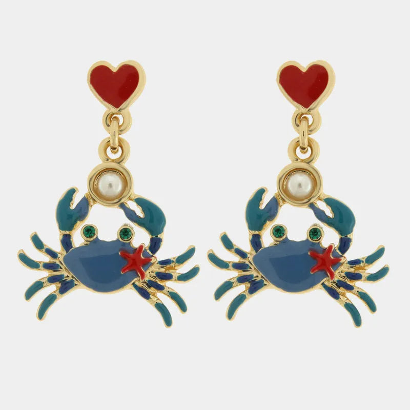 Metal earrings with blue crab