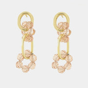 Orecchini in Metallo con cristalli rosa intrecciati