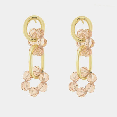 Orecchini in Metallo con cristalli rosa intrecciati