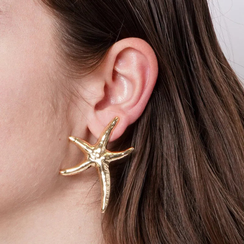 Metal starfish earrings with hammered finish