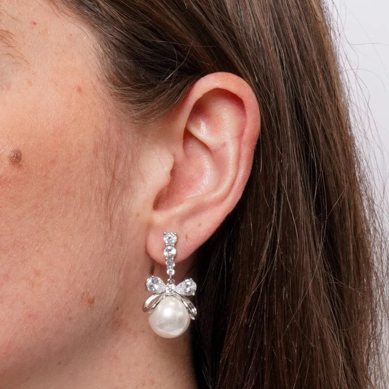 Orecchini in Metallo pendenti con fiocco e perle sintetiche