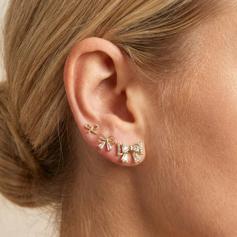 Orecchini in Metallo Set da sei dorato con fiocchi e cristalli