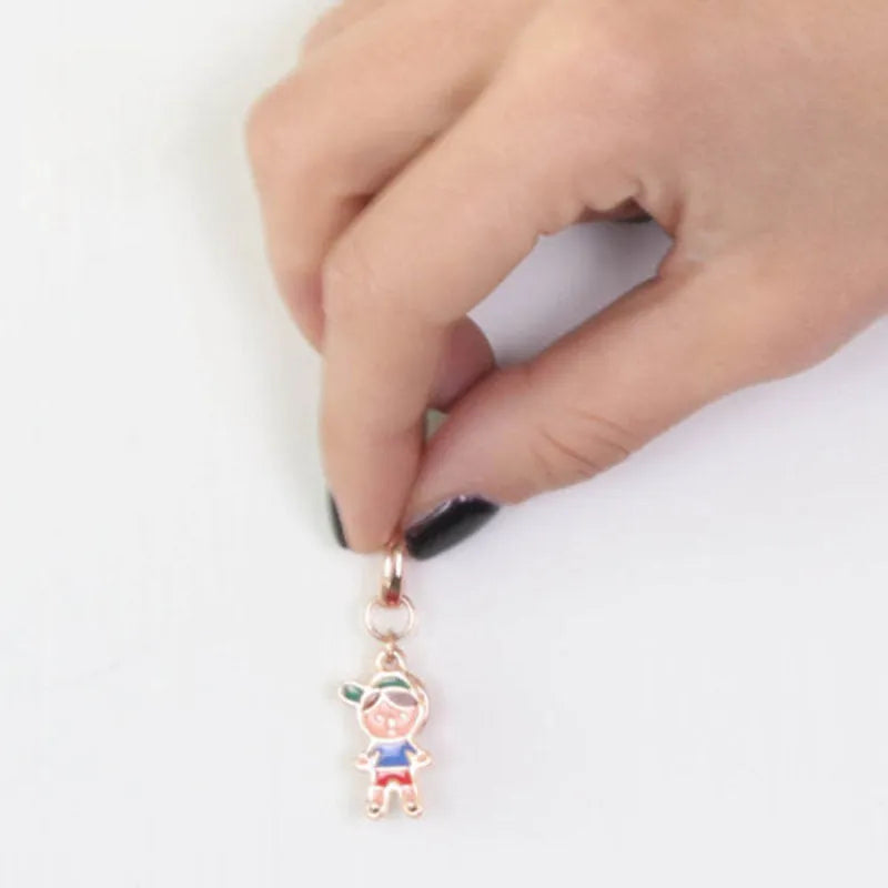 Child metal pendant embellished with colored enamels