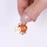 Ciondolo in Metallo con campanella arancione scritta capri