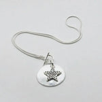 Collana in Metallo stella e medaglietta pendenti con cristalli