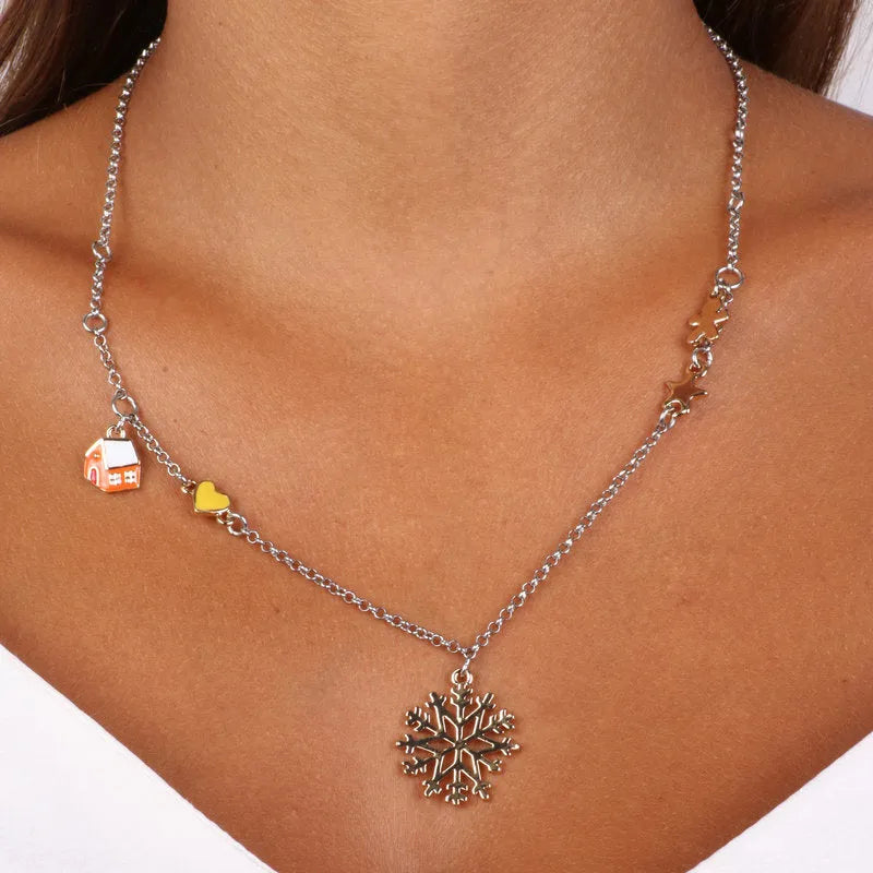 Metal necklace with snowflake-shaped pendant and Christmas details