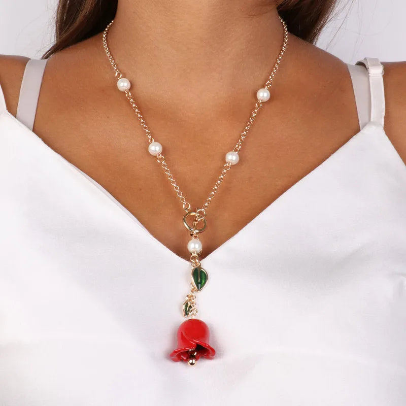 Collana in Metallo con chiusura a T e campanella pendente a forma di rosa rossa e foglie - BYSIMON gioielli