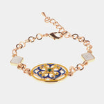 Bracciale in Metallo cristalli bianchi con dettaglio centrale in maiolica a fiore smaltata blu e giallo - BYSIMON gioielli