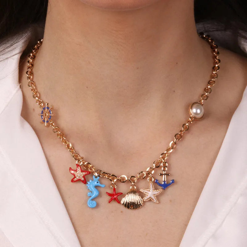 Metal necklace with starfish, shells, anchor and rudder